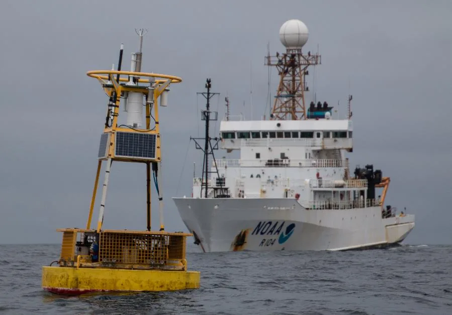 NOAA research ship passing an ocean-acidification monitoring mooring